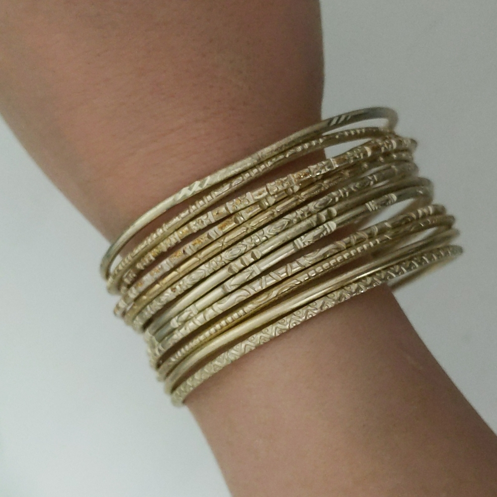 Set of 12 gold bangle bracelets
